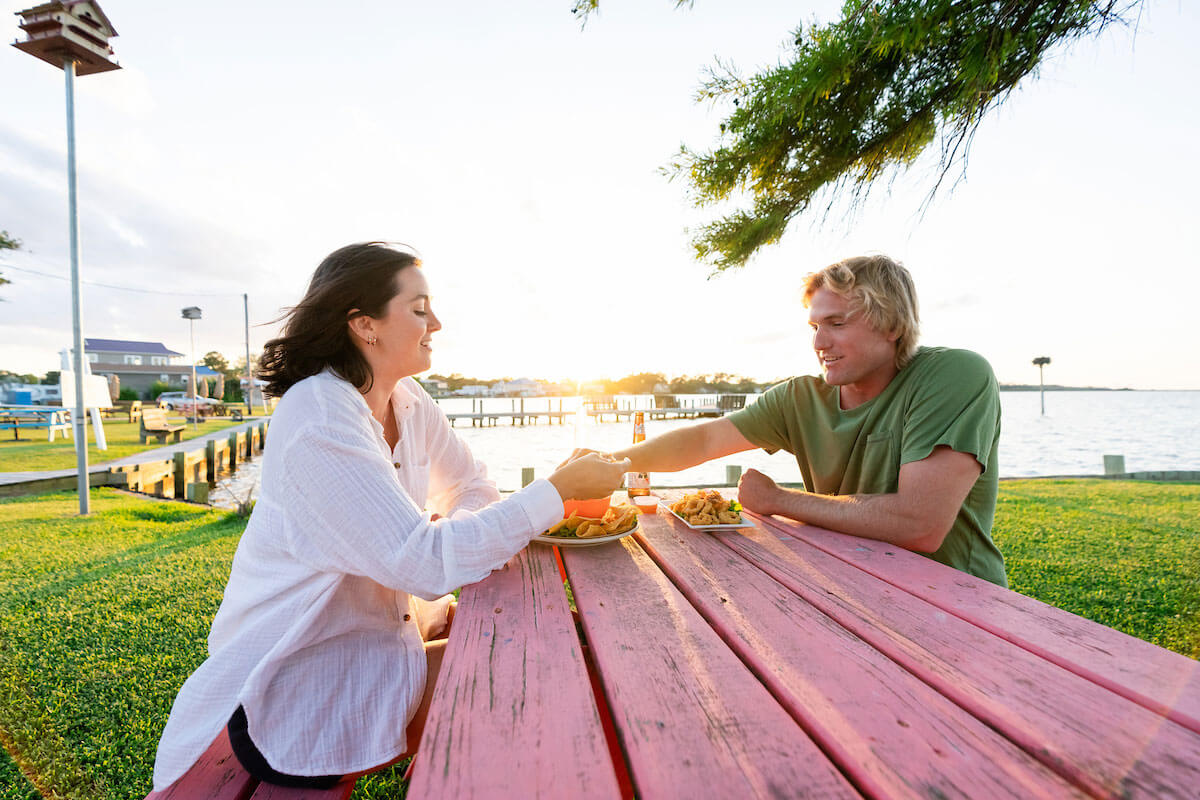couple eating at an outdoor restaurant on the mainland